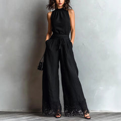 Black halter-neck lace-trim wide-leg jumpsuit with waist belt tie and black lace cuffs