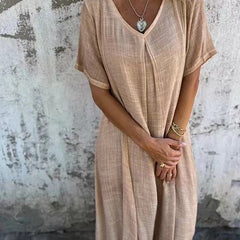 Abito scollo a V beige, maniche corte ampie, tessuto leggero e morbido