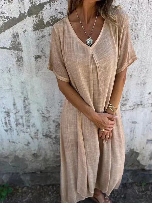 Abito scollo a V beige, maniche corte ampie, tessuto leggero e morbido