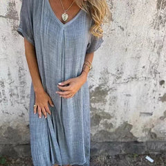 Abito scollo a V blu grigio, maniche corte ampie, tessuto leggero