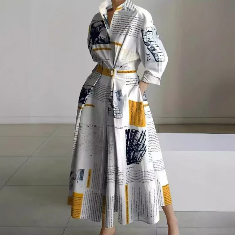 White maxi wrap collared dress with newspaper-style print and yellow accents, three-quarter sleeves