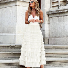 White maxi layered cake skirt with tiered ruffle layers and gathered waistline