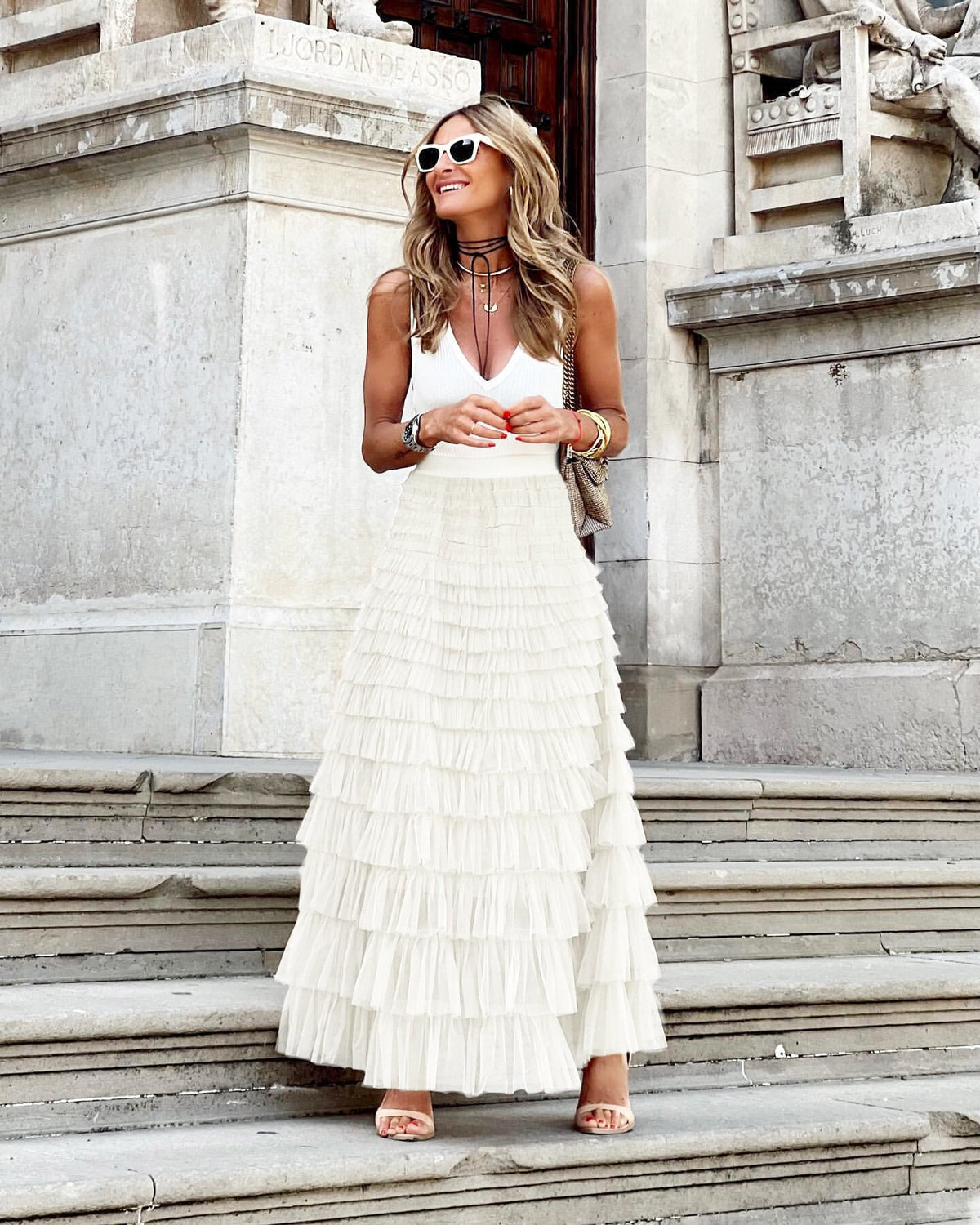 White maxi layered cake skirt with tiered ruffle layers and gathered waistline
