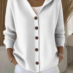 White hooded button-up knit cardigan with dark buttons, long sleeves