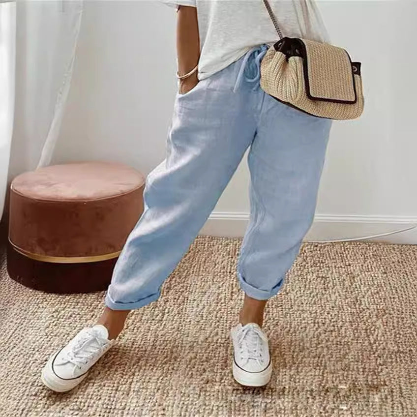 Light blue breathable casual trousers with tapered legs and cuffed hem