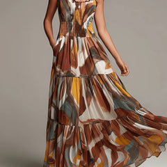 Smocked tiered maxi dress in abstract print with spaghetti straps and tiered skirt