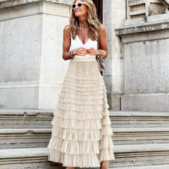 Cream maxi layered cake skirt with tiered ruffle layers and gathered waistline