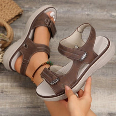Brown supportive orthopaedic sandals with two hook-and-loop straps and molded sole