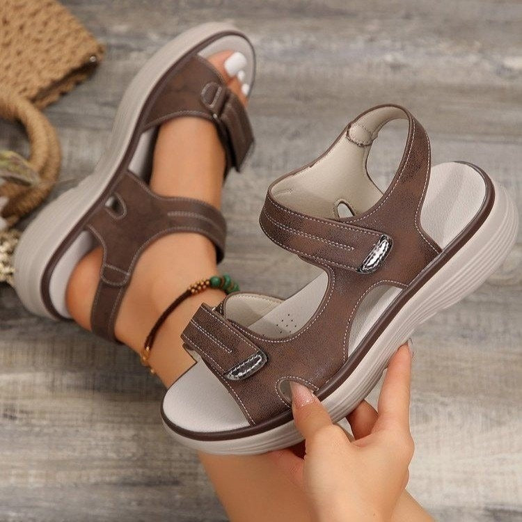 Brown supportive orthopaedic sandals with two hook-and-loop straps and molded sole