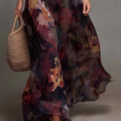 Pleated maxi skirt with watercolor floral print and flowing layered hem