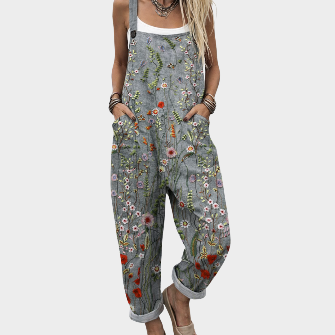 Gray floral printed overalls with adjustable straps, bib front, and roomy wide-leg fit