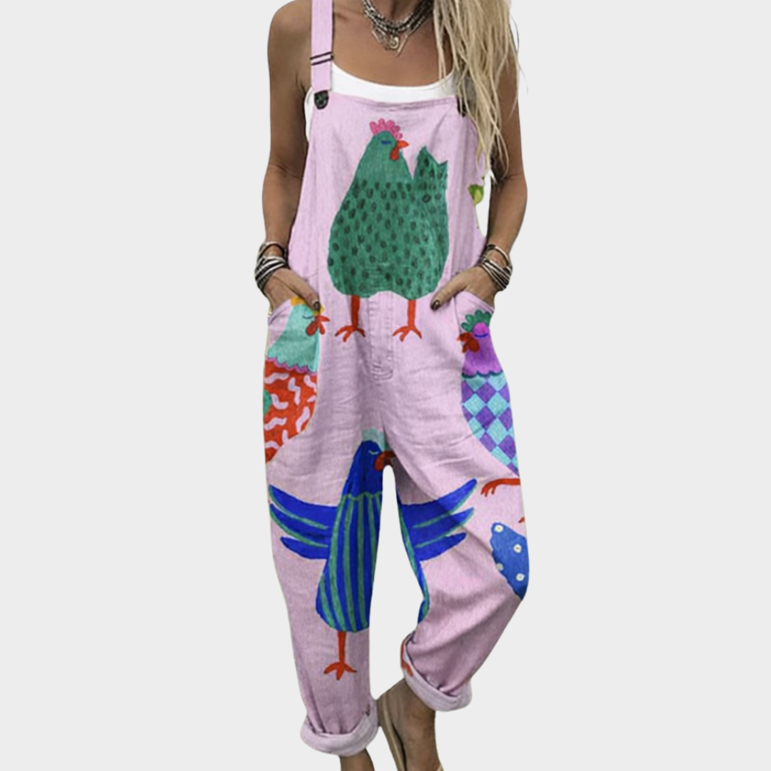 Pink printed overalls with colorful bird and patchwork graphic, adjustable shoulder straps