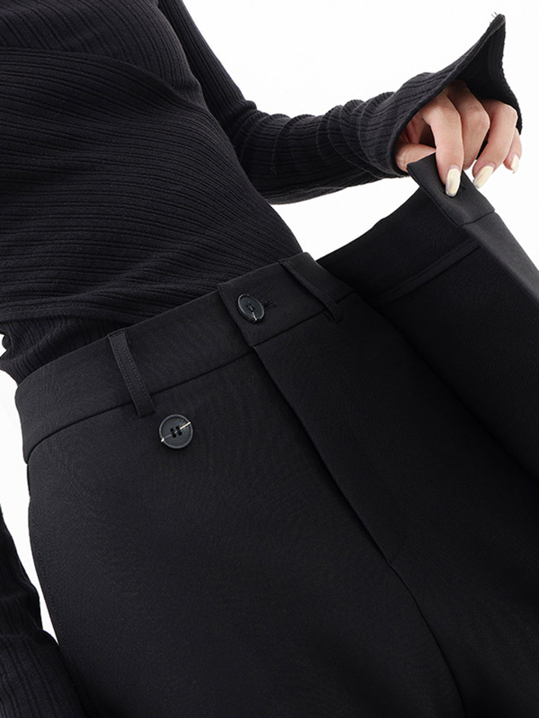 Pantaloni neri a vita alta con cintura, bottoni frontali e tasche