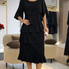 Black ruffle tier midi dress with short cape sleeves and layered skirt
