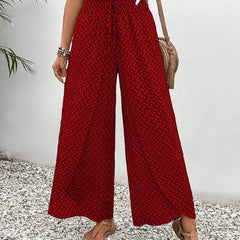 Red wide-leg trousers with shirred waistband and allover micro pattern, ankle length.