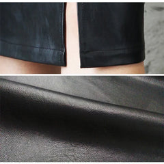 Black leather skirt fabric close-up with smooth grain texture