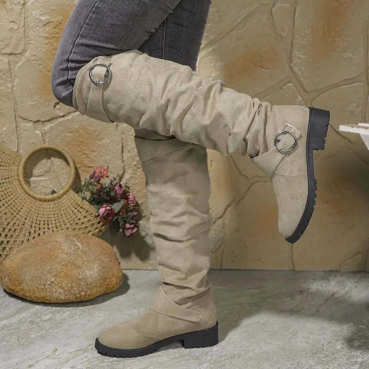 Knee-high beige suede boots with buckle rings and chunky lug sole