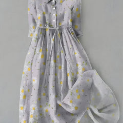 White daisy-print dress with button-front bodice and gathered skirt, long sleeves