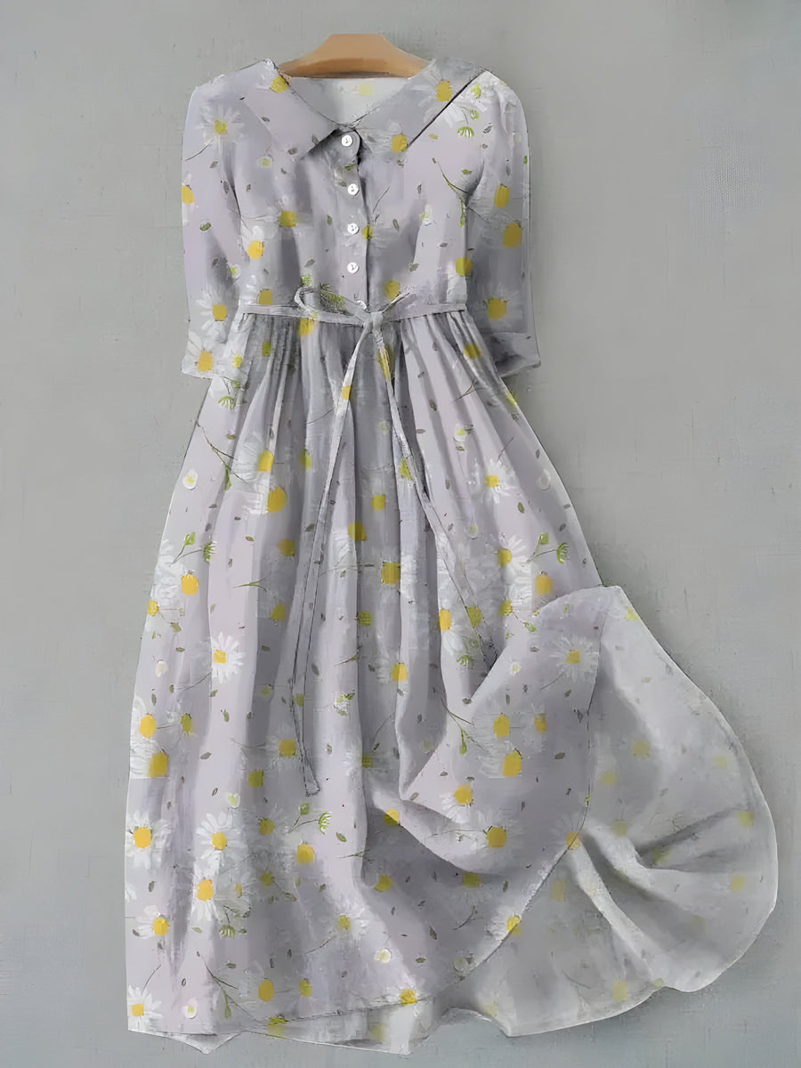 White daisy-print dress with button-front bodice and gathered skirt, long sleeves