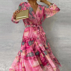 Floral maxi dress in pink with V-neck wrap, tiered skirt, long puff sleeves, cinched waist