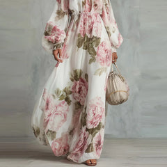 White floral off-shoulder maxi dress with long puff sleeves and flowing skirt