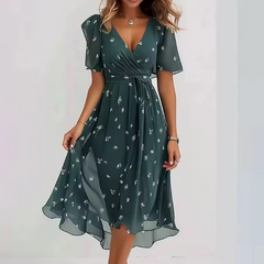 Vestito midi verde petrolio con scollatura a V, maniche corte e piccoli fiori chiari