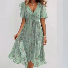 Vestito midi verde chiaro con scollatura a V, maniche corte e stampa floreale