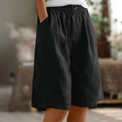 Pantaloni corti neri con vita elasticizzata e bottone, pieghe davanti