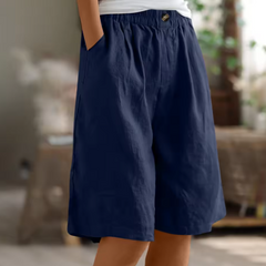 Relaxed summer shorts in navy, elastic waistband and front button, knee length.