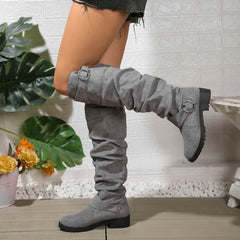 Knee-high grey suede boots with buckle rings and chunky lug sole