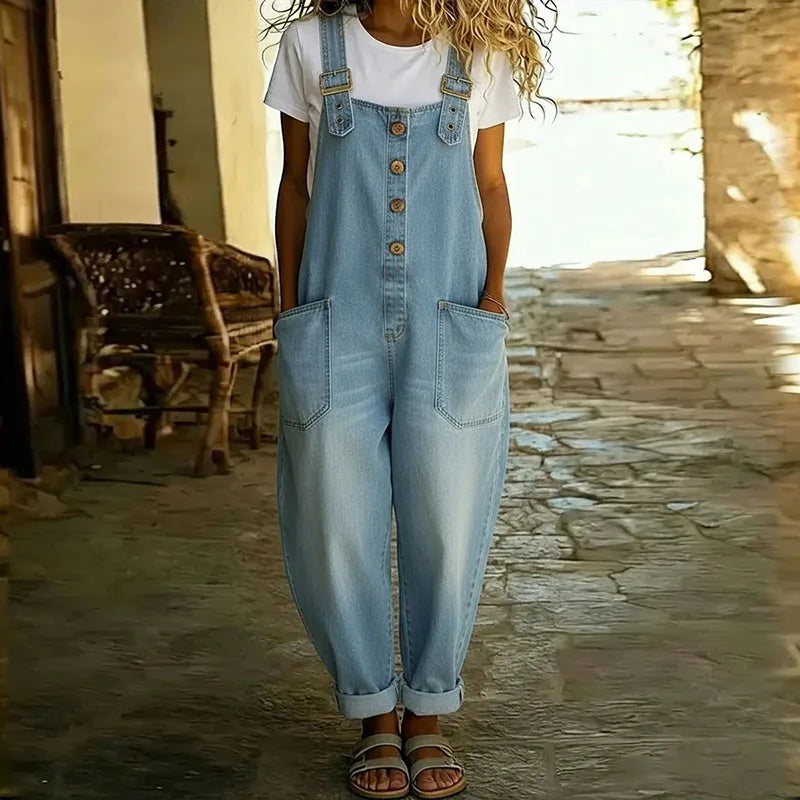 Light blue denim overalls with adjustable straps, button front, and two front pockets.