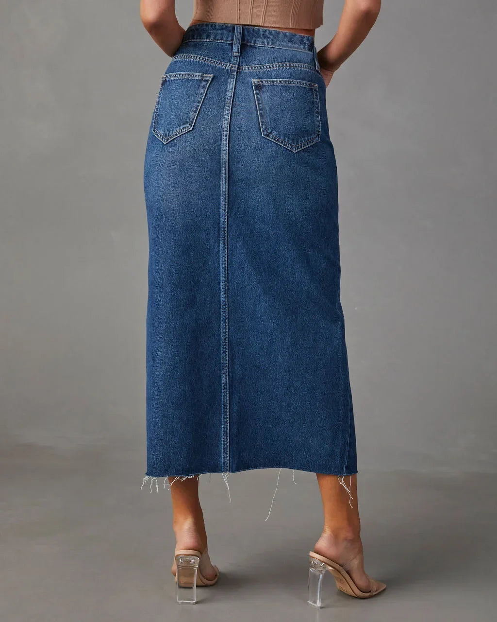 High-waist denim midi skirt with back yoke and patch pockets, blue wash