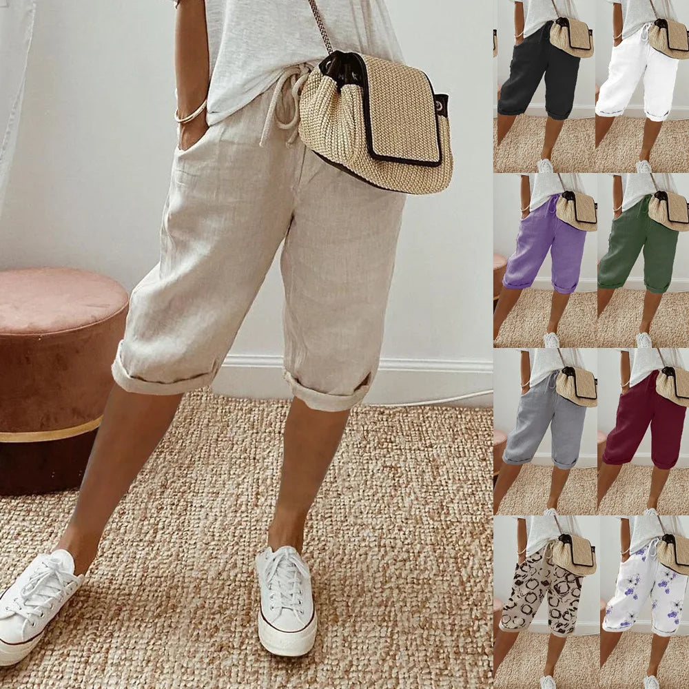 Lightweight summer shorts in cream with rolled cuffs, drawstring waist, side pockets.