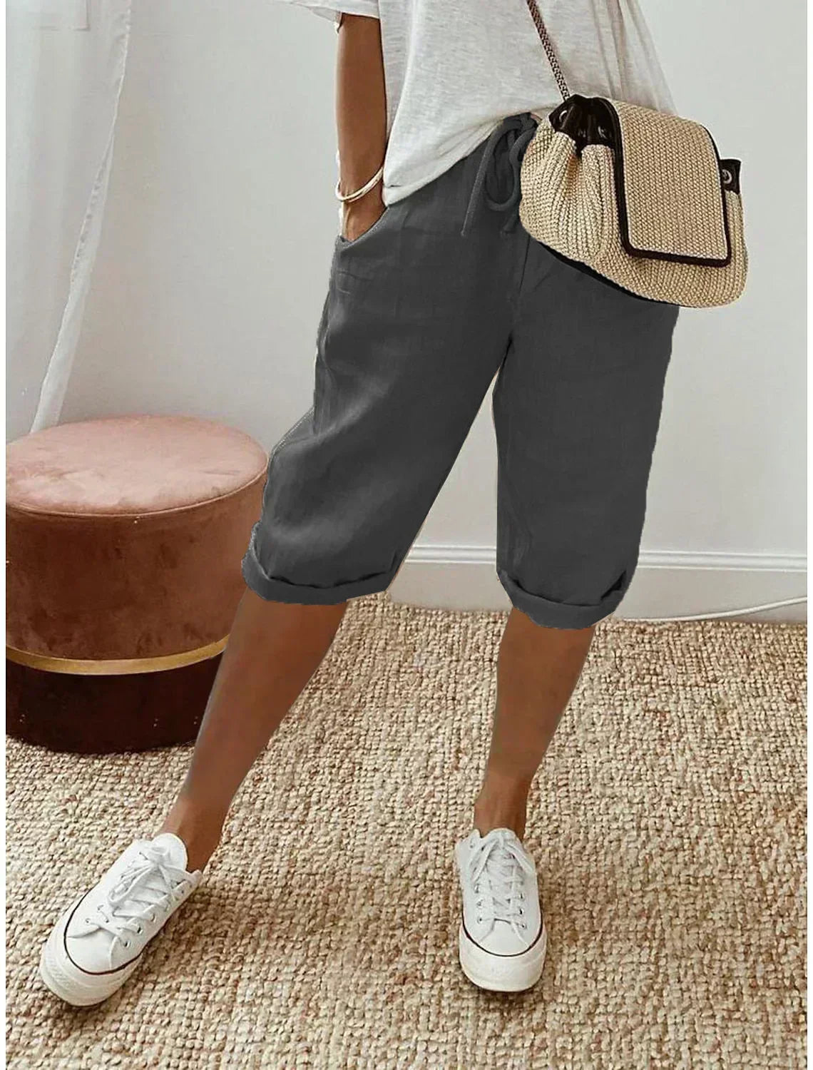 Lightweight summer shorts in dark gray, rolled cuffs, drawstring waist, side pockets.