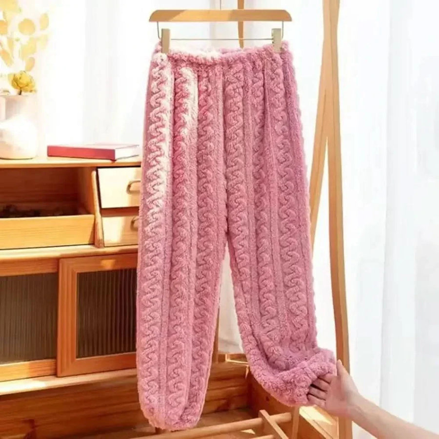 Pink soft-lined cable knit pants with elastic waistband and relaxed straight legs