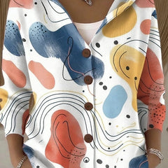 Hooded button-front cardigan with abstract face-like multicolor shapes