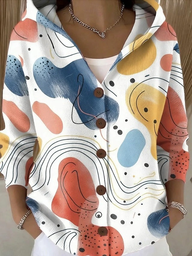 Hooded button-front cardigan with abstract face-like multicolor shapes