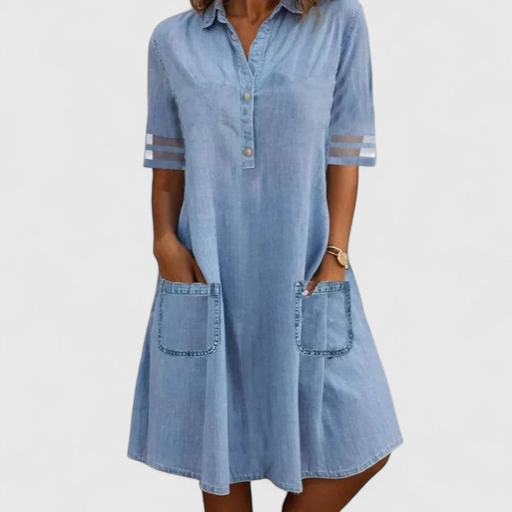 Light blue denim shirt dress with button front, short sleeves, and two chest pockets