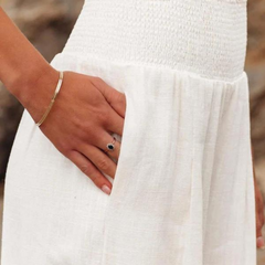 White wide-leg trousers with shirred waist and textured woven fabric