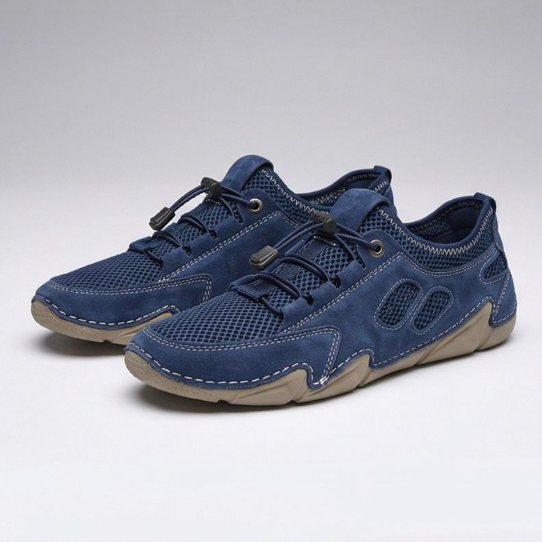 Scarpe da uomo blu con lacci e pannelli traforati, suola chiara ammortizzata