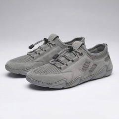 Scarpe da ginnastica leggere grigie con lacci e inserti in mesh, suola sagomata