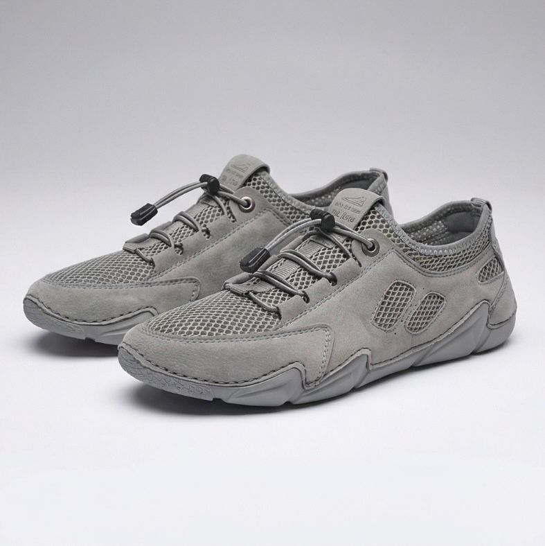 Scarpe da ginnastica leggere grigie con lacci e inserti in mesh, suola sagomata
