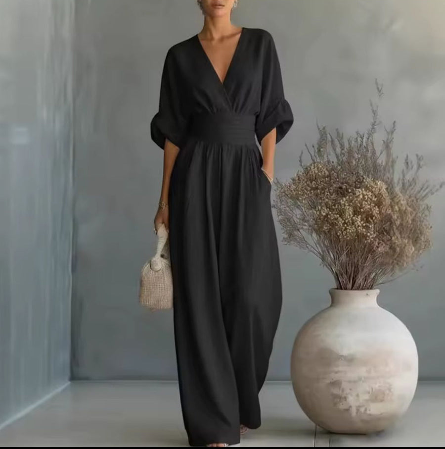 Black wrap V-neck jumpsuit with tie waist and wide-leg pants, kimono sleeves