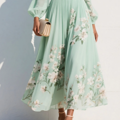 Abito midi verde chiaro con stampa floreale, gonna ampia e arricciatura in vita