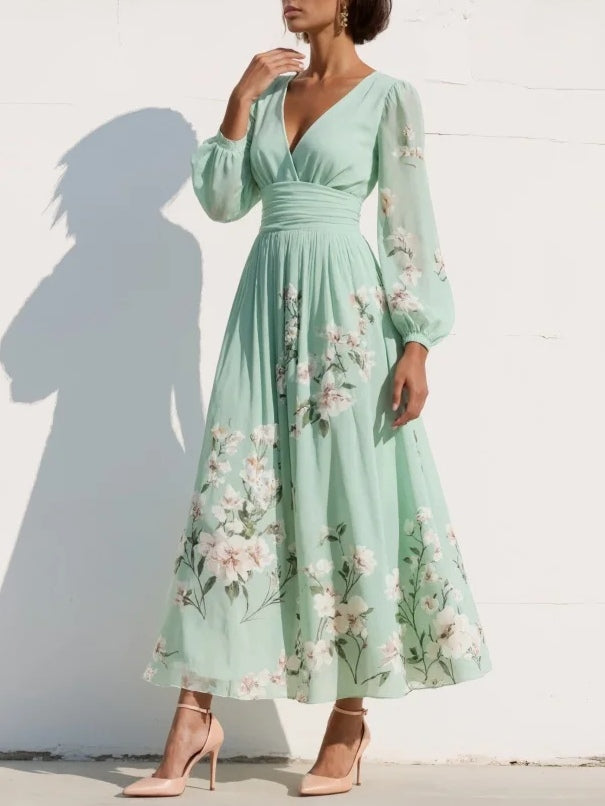 Vestito midi verde chiaro con scollo a V, maniche lunghe a sbuffo e fiori