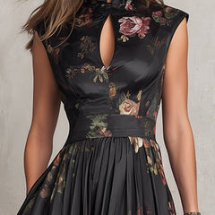Black satin midi dress close-up: floral print, sleeveless keyhole neckline bodice