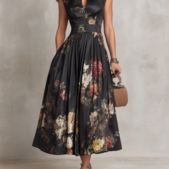 Black satin midi dress with pleated skirt, floral print, sleeveless keyhole neckline