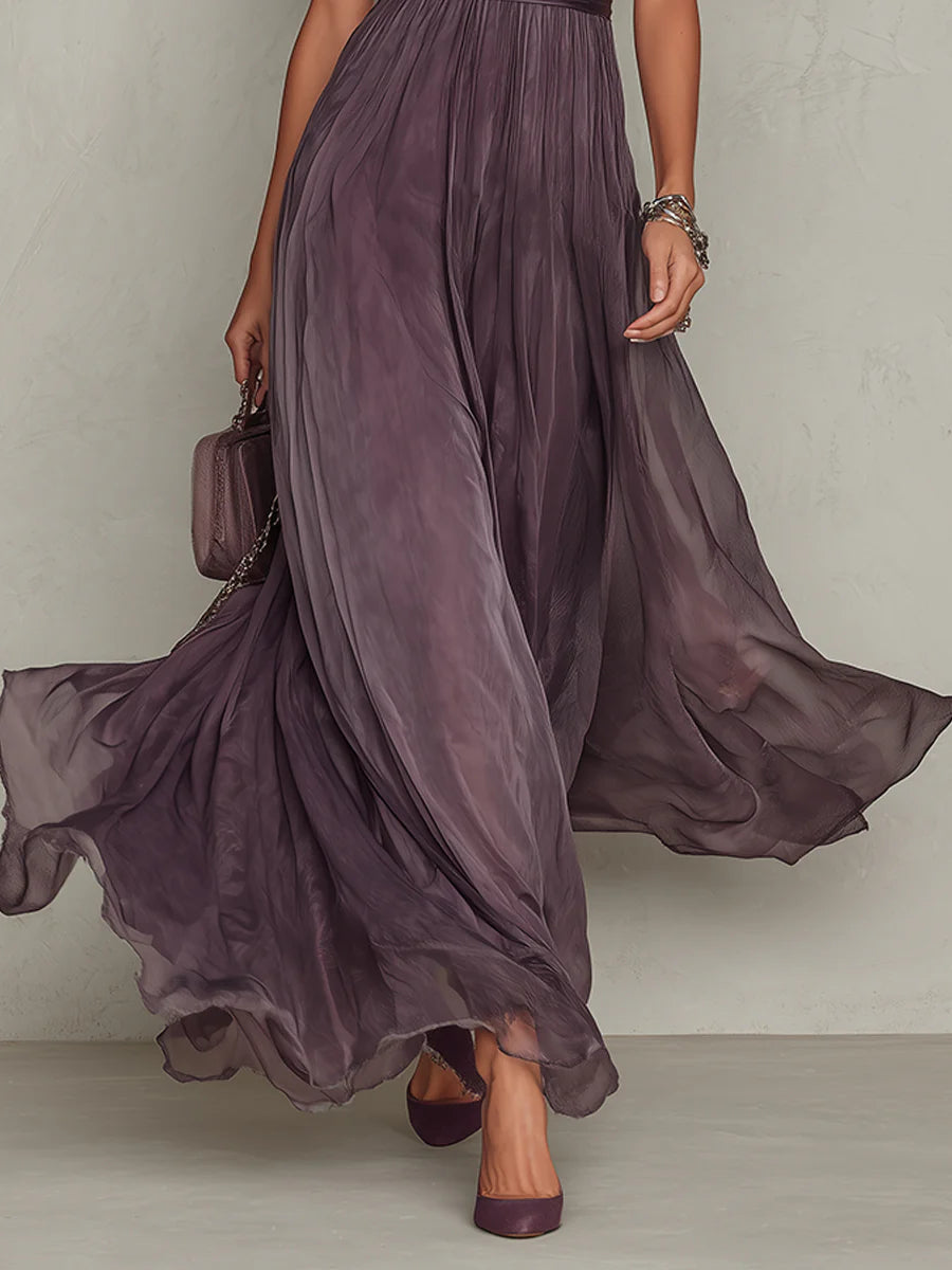 Abito maxi viola in tulle, pieghe sulla gonna e fondo ampio