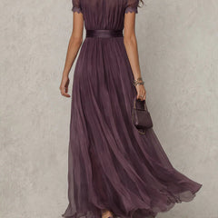 Abito maxi viola in tulle con cintura in vita e gonna ampia, vista posteriore