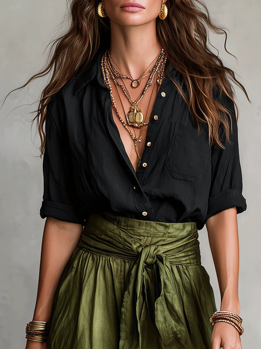 Black blouse top and olive green midi skirt two-piece set, close-up neckline and waist